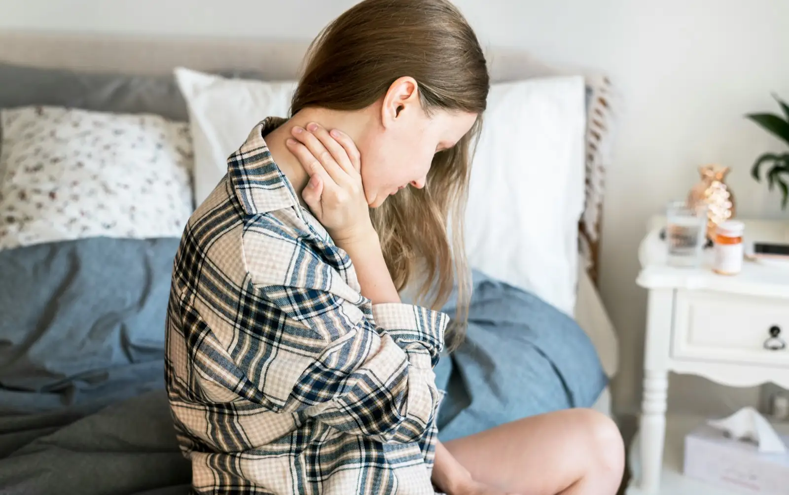 Woman experiencing chronic fatigue and pain — common symptoms of CIRS